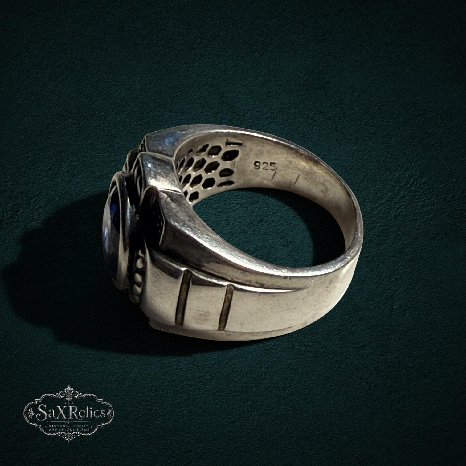 My Store SAXRelics sterling silver statement ring with deep blue oval gemstone and honeycomb interior gallery detail.