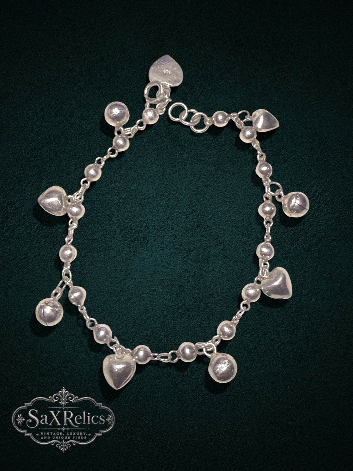 My Store SAXRelics sterling silver charm bracelet featuring polished spheres and heart dangles on a delicate chain