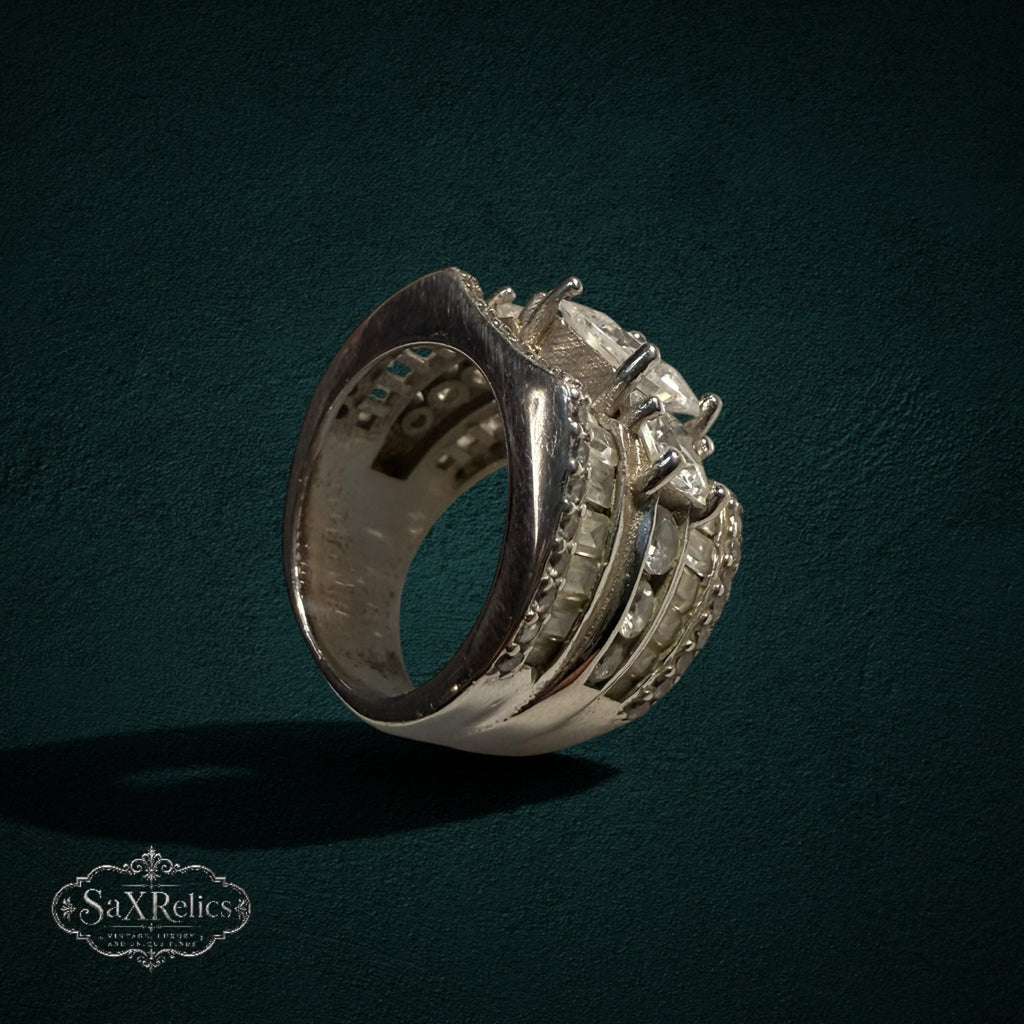 My Store SAXRelics sterling silver wide band statement ring with sparkling baguette-cut and round stones.