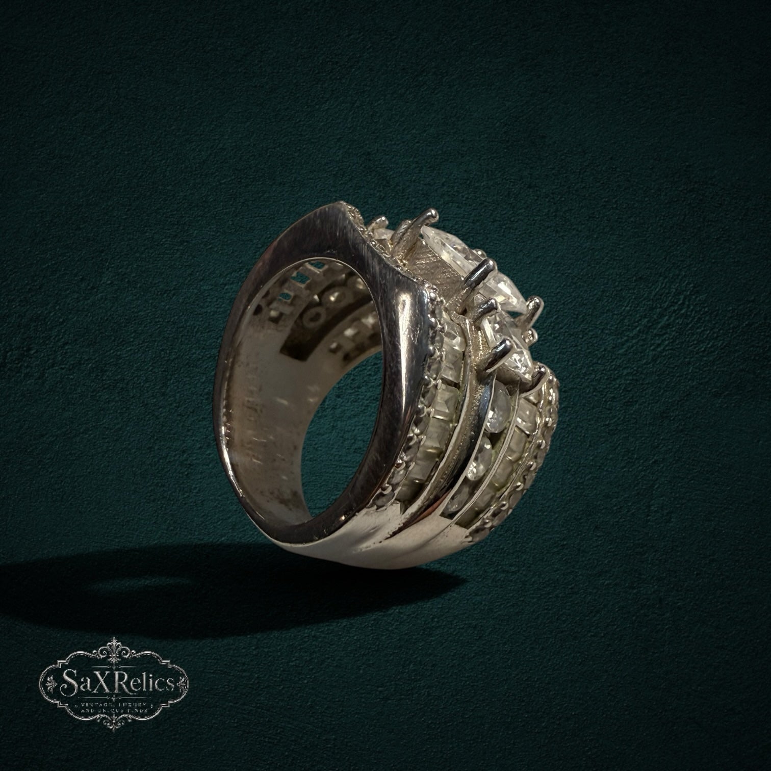 My Store SAXRelics sterling silver wide band statement ring with sparkling baguette-cut and round stones.