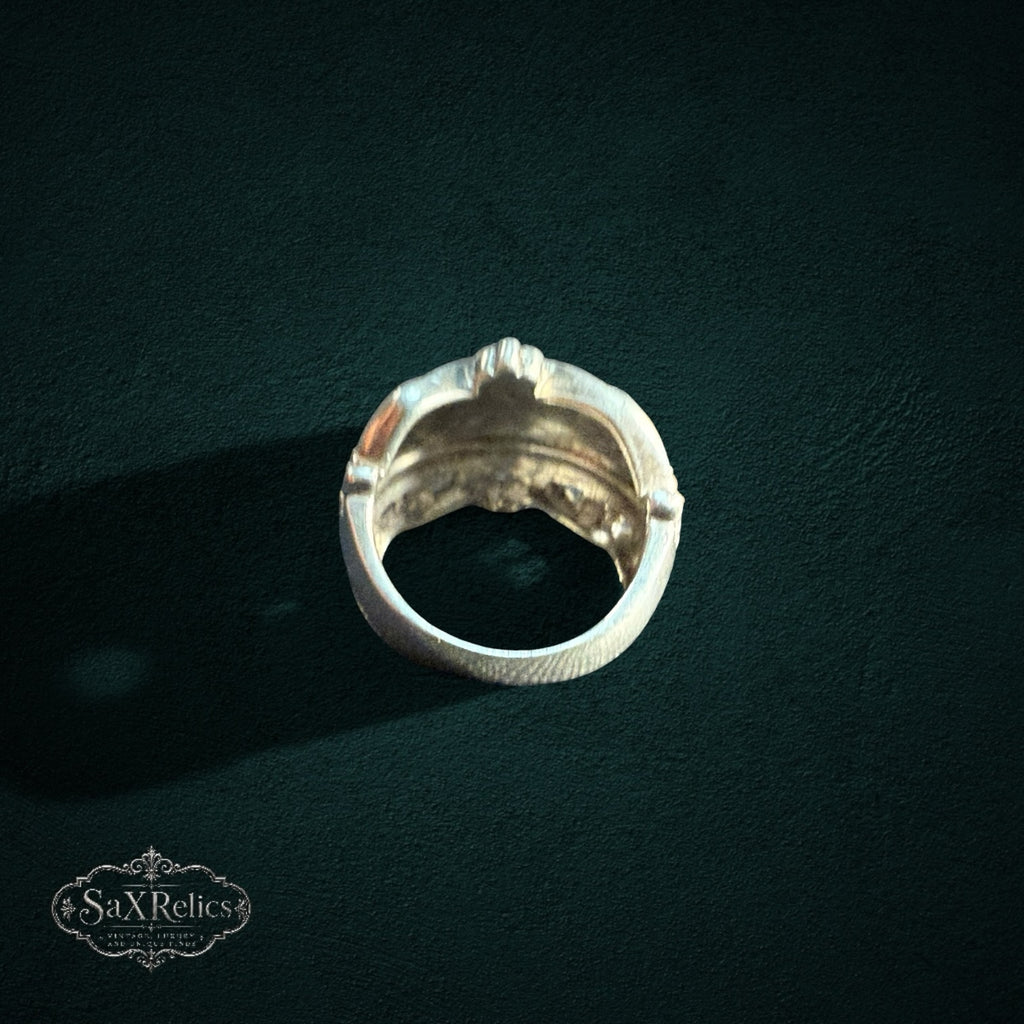 My Store SAXRelics sterling silver statement ring with a polished dome, beaded borders, and textured cross-hatch band.