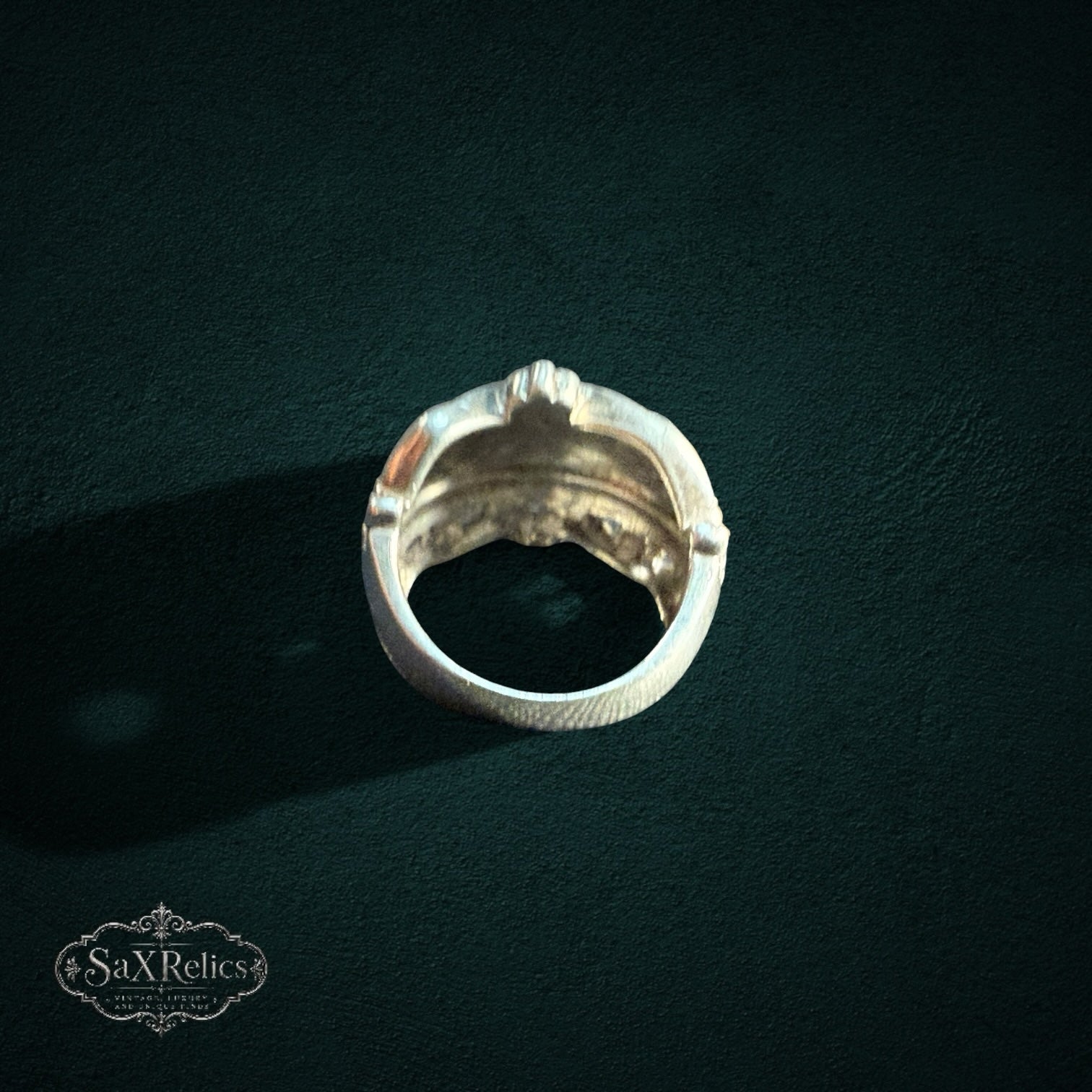 My Store SAXRelics sterling silver statement ring with a polished dome, beaded borders, and textured cross-hatch band.