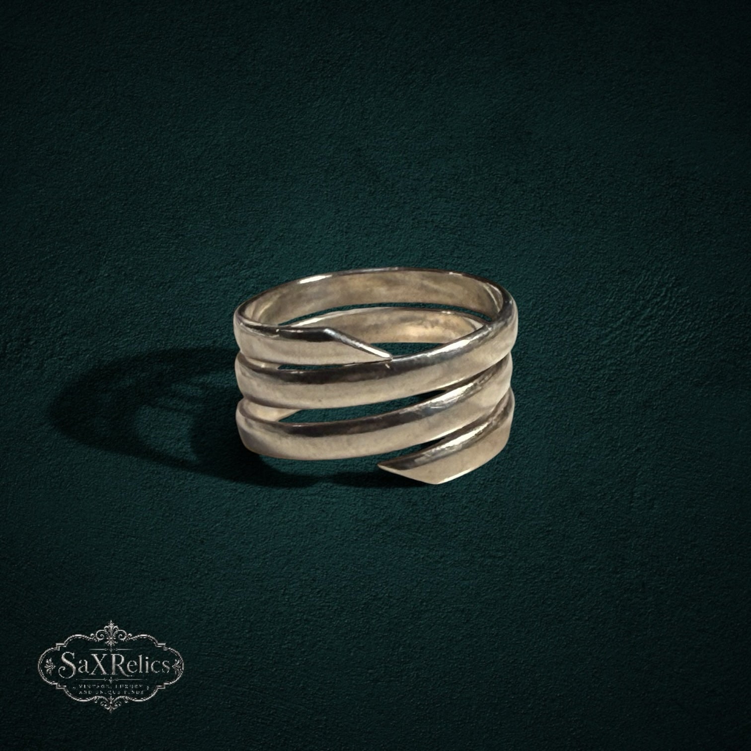 My Store SAXRelics multi-layered sterling silver wrap ring with a polished, sculptural coil design.