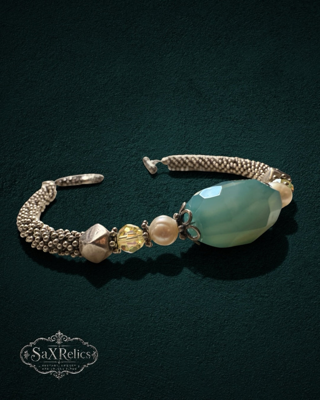 My Store SaxRelics beaded bracelet with a large teal gemstone, pearls, yellow crystals, and a silver-toned mesh chain.
