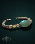 My Store SaxRelics beaded bracelet with a large teal gemstone, pearls, yellow crystals, and a silver-toned mesh chain.