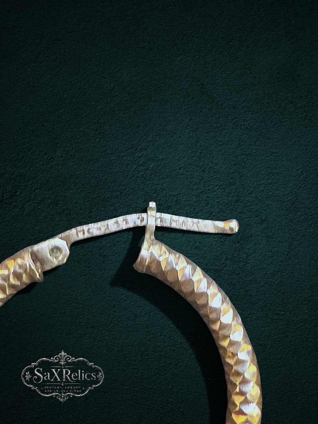 My Store SAXRelics textured hoop earrings featuring a diamond-cut geometric pattern and a secure hinge closure.