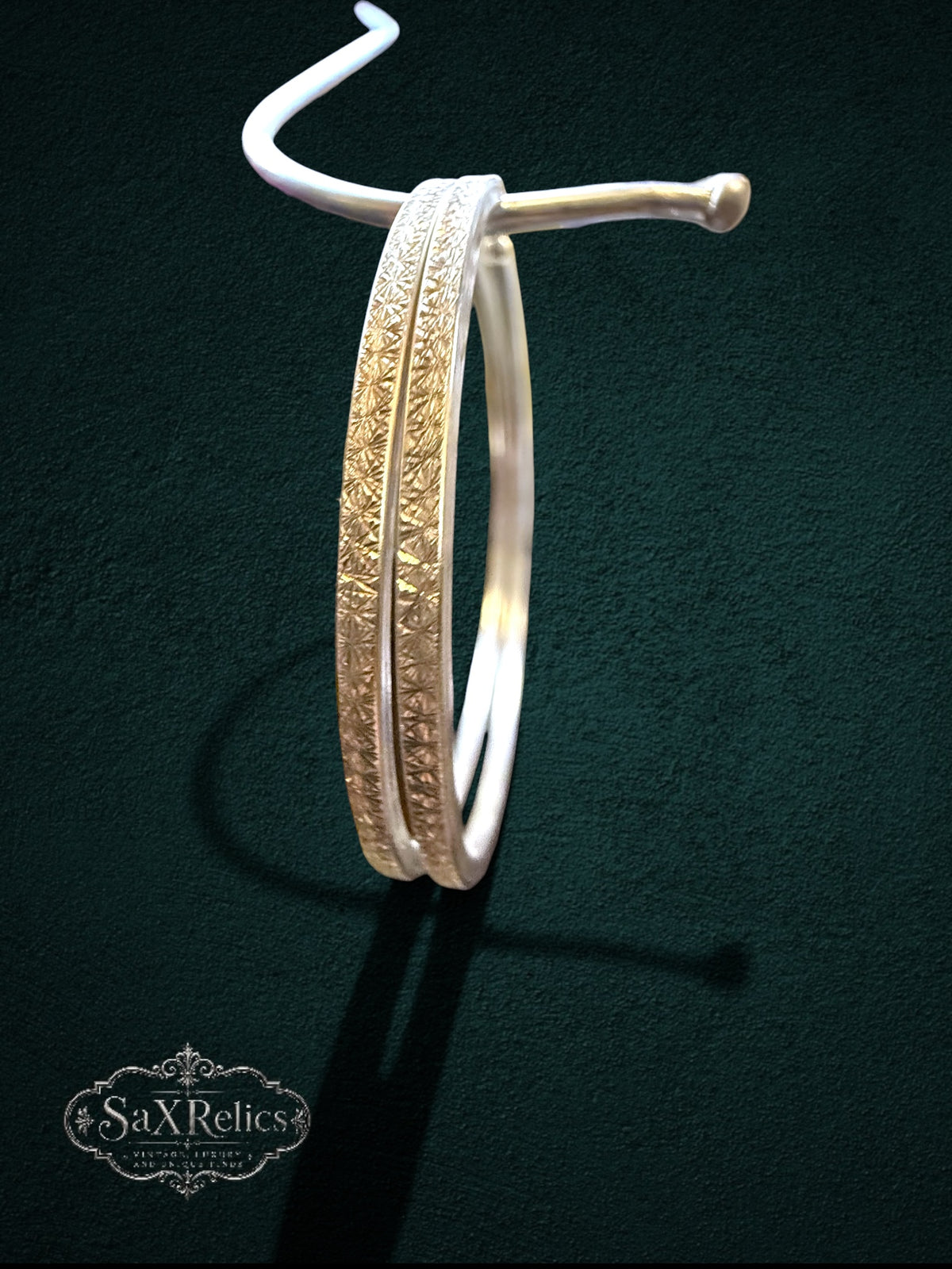 My Store SaxRelics large sterling silver hoop earrings featuring an intricate etched textured pattern on a dark background
