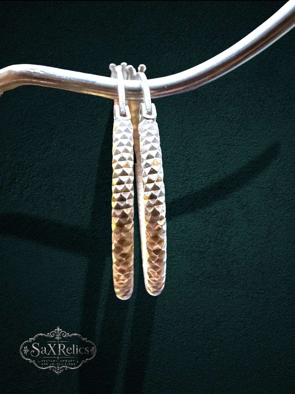 My Store SAXRelics silver hoop earrings featuring a diamond-cut textured geometric pattern for a brilliant sparkle.