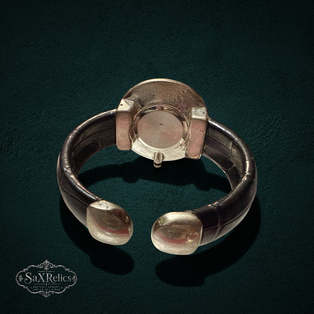 SaX Relics vintage cuff watch detail of the croc-embossed vinyl cuff and polished silver-tone case