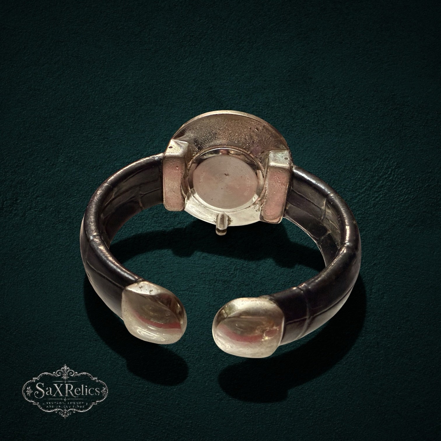 SaX Relics vintage cuff watch detail of the croc-embossed vinyl cuff and polished silver-tone case