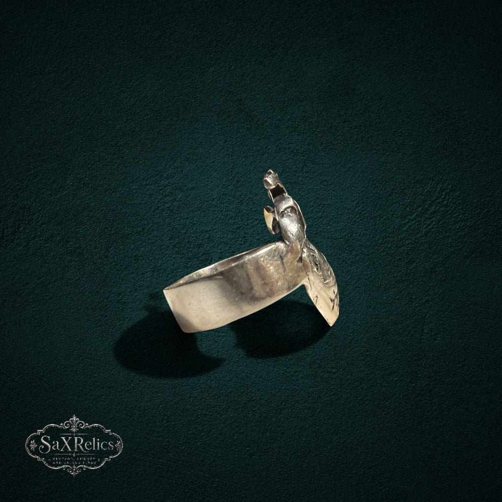 My Store SAXRelics silver anatomical heart statement ring with detailed realistic design on a dark textured background