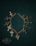 My Store SaxRelics silver-tone charm bracelet featuring various ornate and minimalist cross pendants on a chain