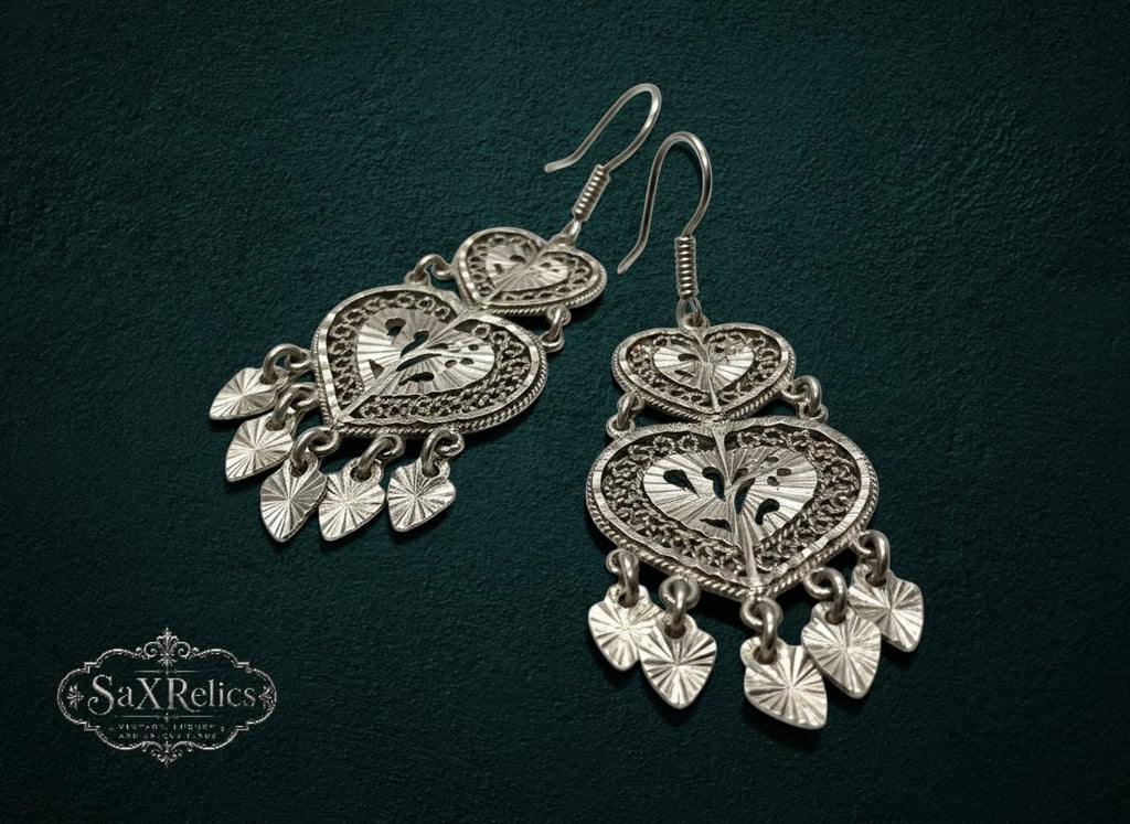 My Store SAXRelics silver filigree heart drop earrings with intricate metalwork and dangling heart charms.