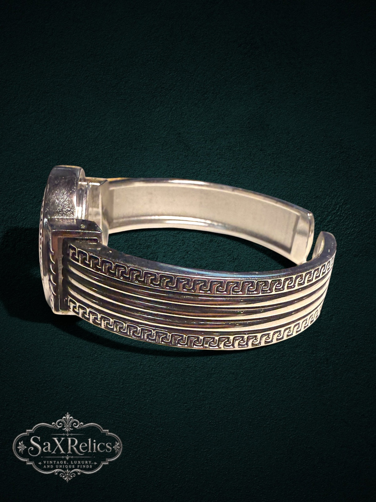 My Store silver-tone cuff watch with intricate Greek key motif on the band and bezel, side view