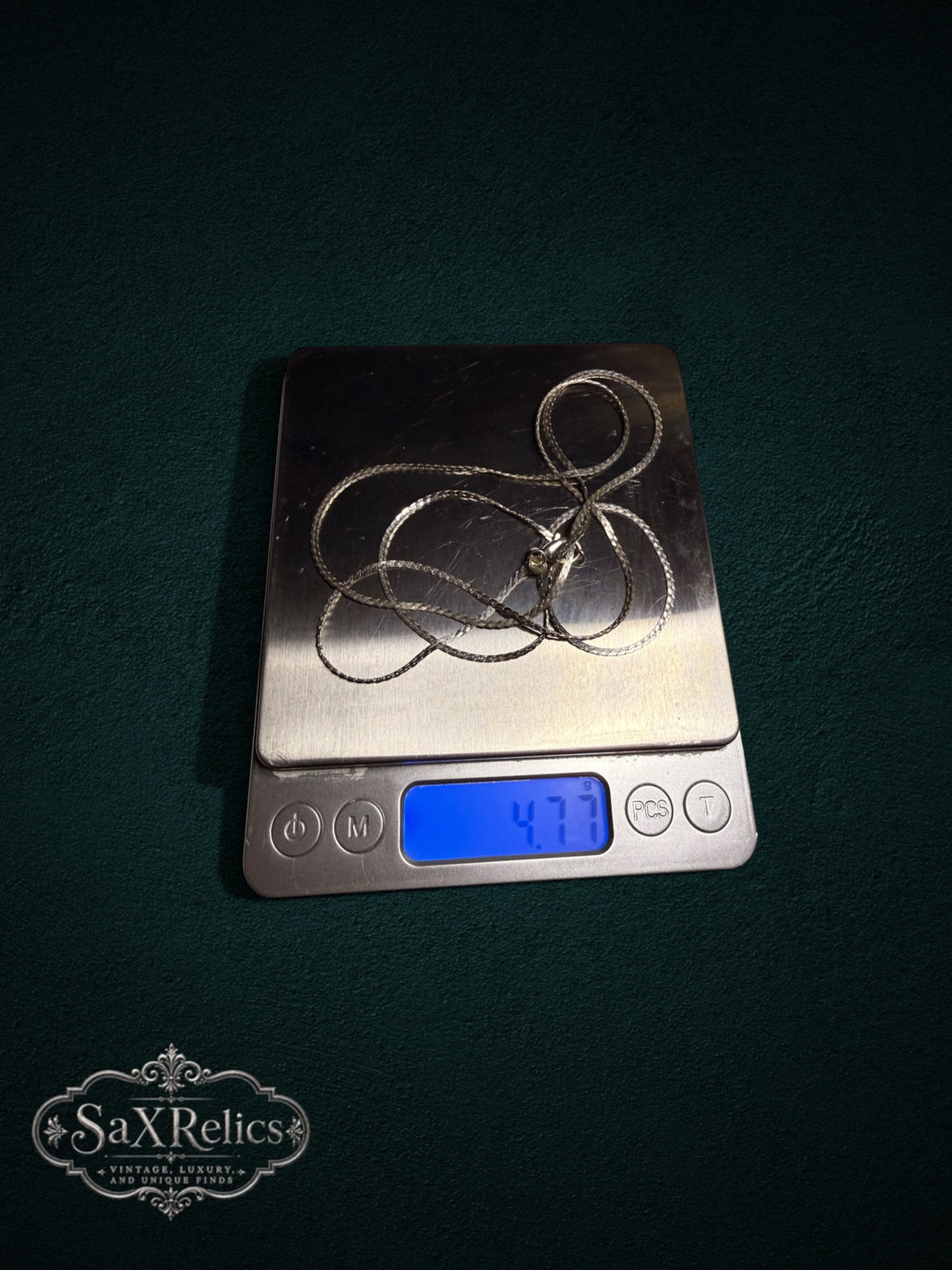 Arroyo sterling silver herringbone chain weighing 4.77 grams on a scale
