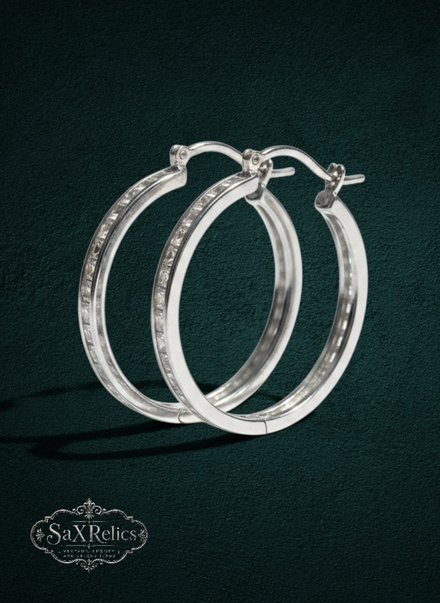 My Store SAXRelics silver-tone hoop earrings with channel-set clear stones and a polished finish.