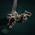 SaX Relics — Pantera Mexican sterling silver leaping panther pendant with red cubic zirconia eyes on a link chain.