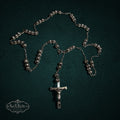My Store SAXRelics silver-tone metallic prayer rosary beads with a detailed crucifix centerpiece on dark background