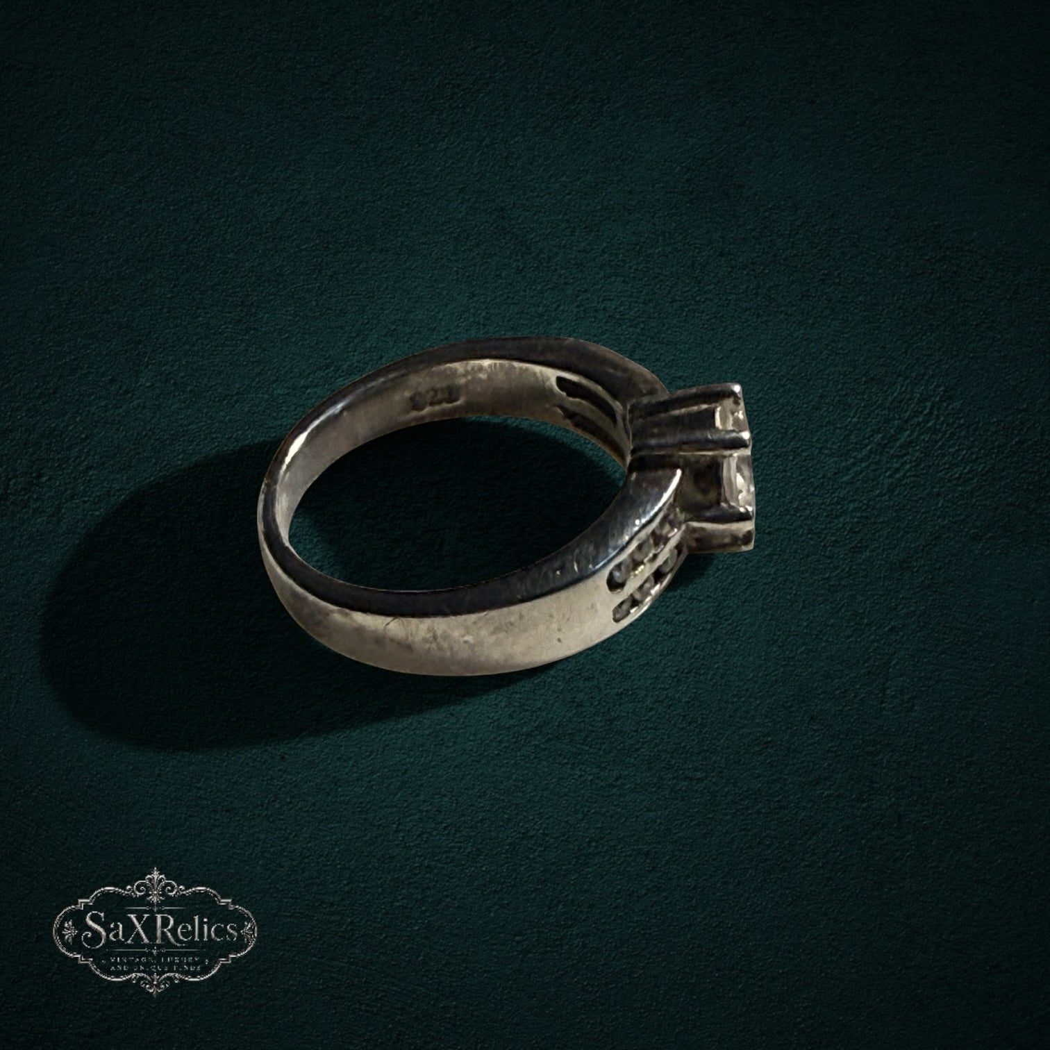 My Store silver-tone solitaire ring with a prong-set center stone and shimmering accent stones on the band