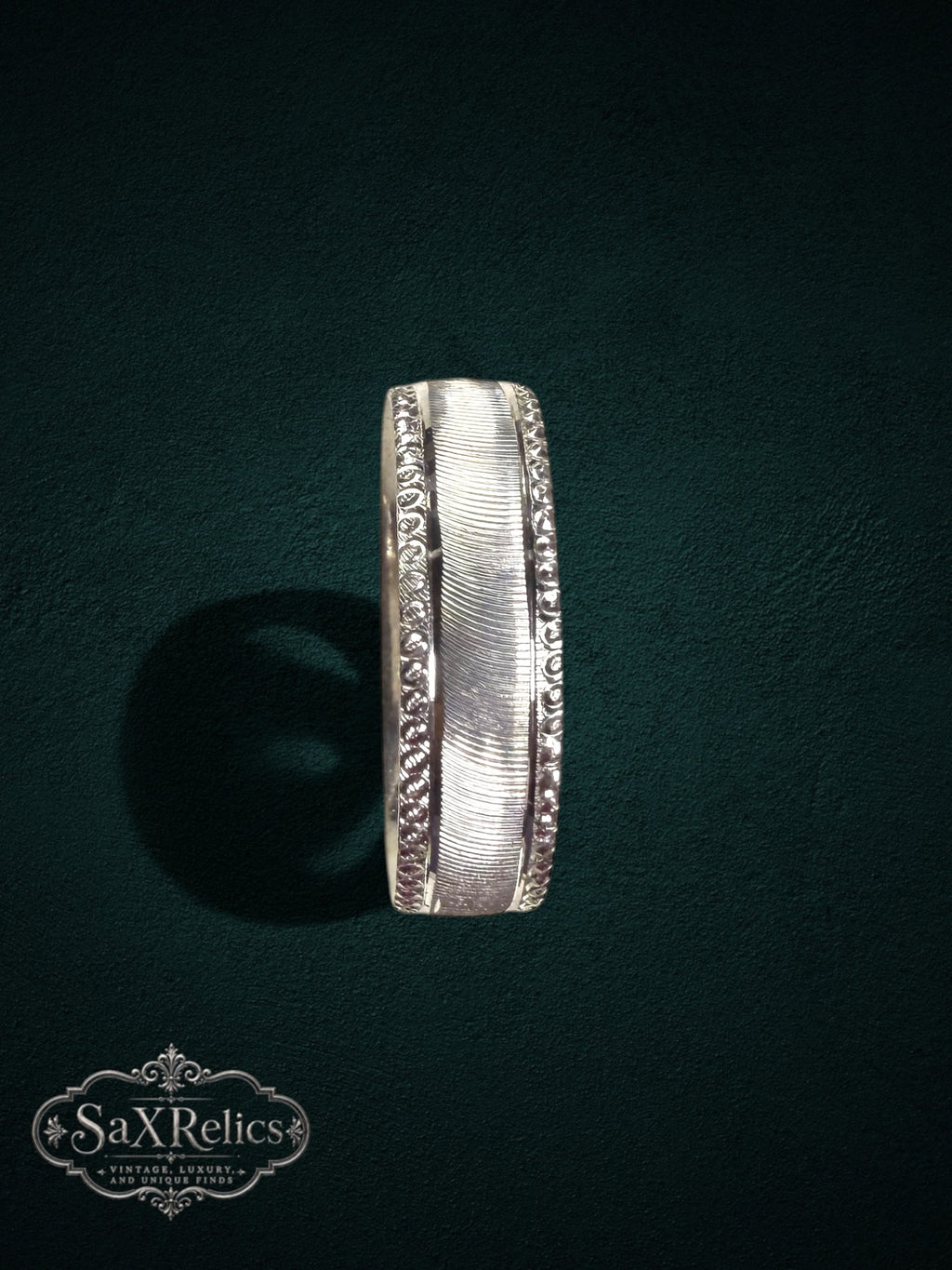 My Store silver band ring featuring a brushed center finish and intricate beaded edges with a vintage-inspired design.
