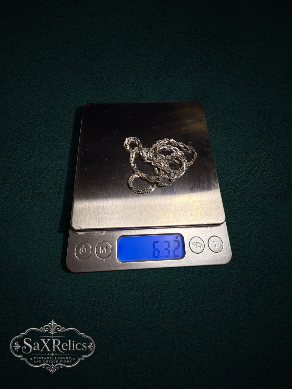 Torzal sterling silver twisted chain weighing 6.32 grams on a scale