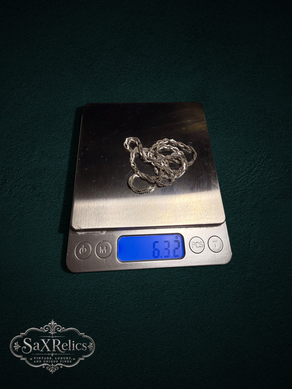 Torzal sterling silver twisted chain weighing 6.32 grams on a scale