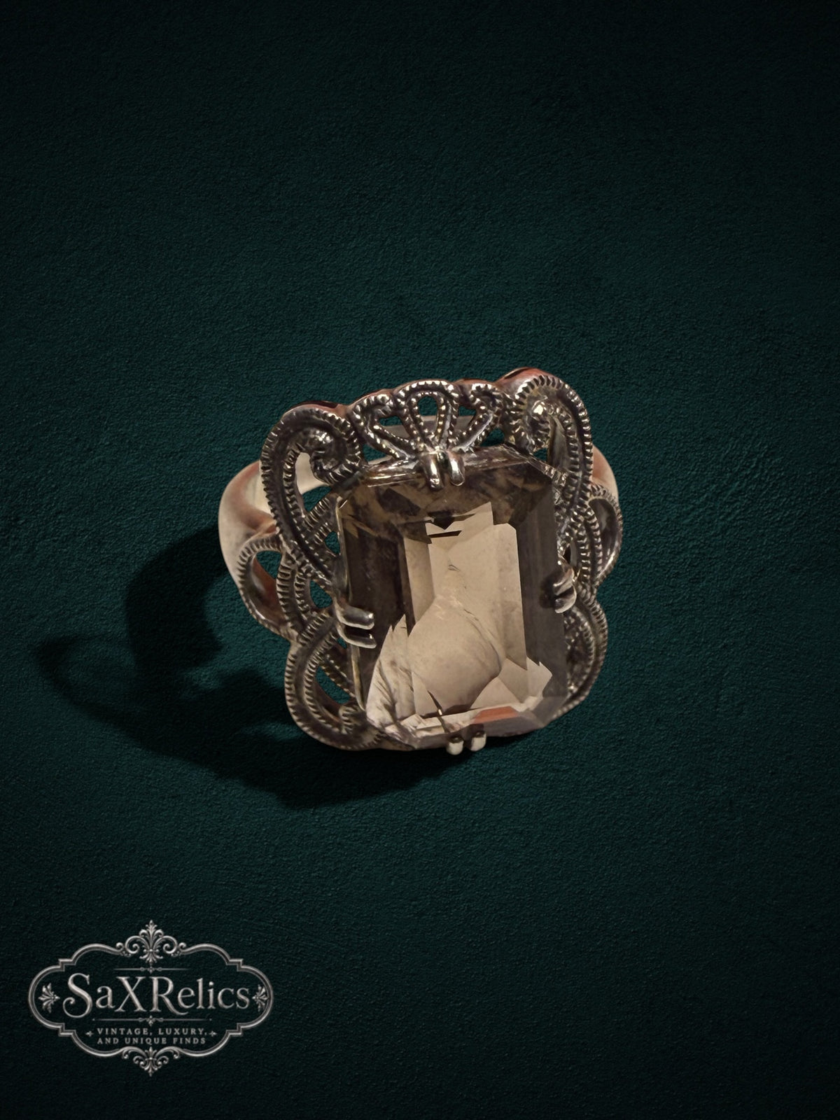 My Store SaxRelics vintage statement ring featuring an emerald-cut smoky quartz in an ornate silver filigree setting.