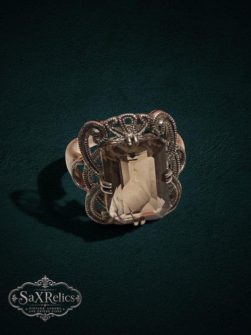 My Store SaxRelics vintage statement ring featuring an emerald-cut smoky quartz in an ornate silver filigree setting.