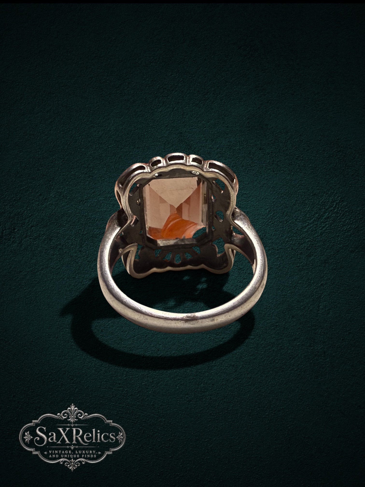 My Store SaxRelics vintage statement ring with emerald-cut smoky quartz in an ornate silver filigree setting.