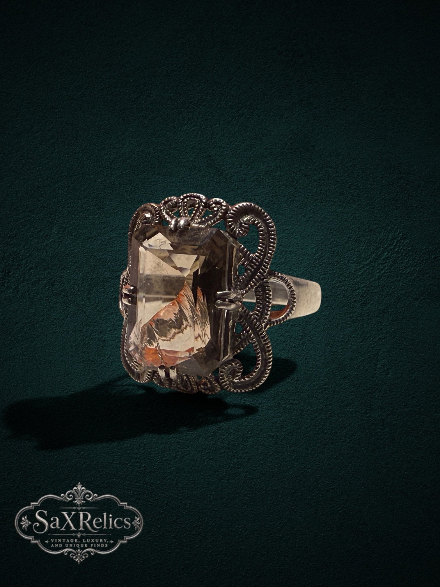 My Store SaxRelics vintage statement ring featuring an emerald-cut smoky quartz in an ornate silver filigree setting.