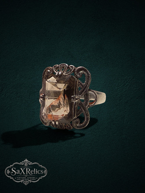 My Store SaxRelics vintage statement ring featuring an emerald-cut smoky quartz in an ornate silver filigree setting.