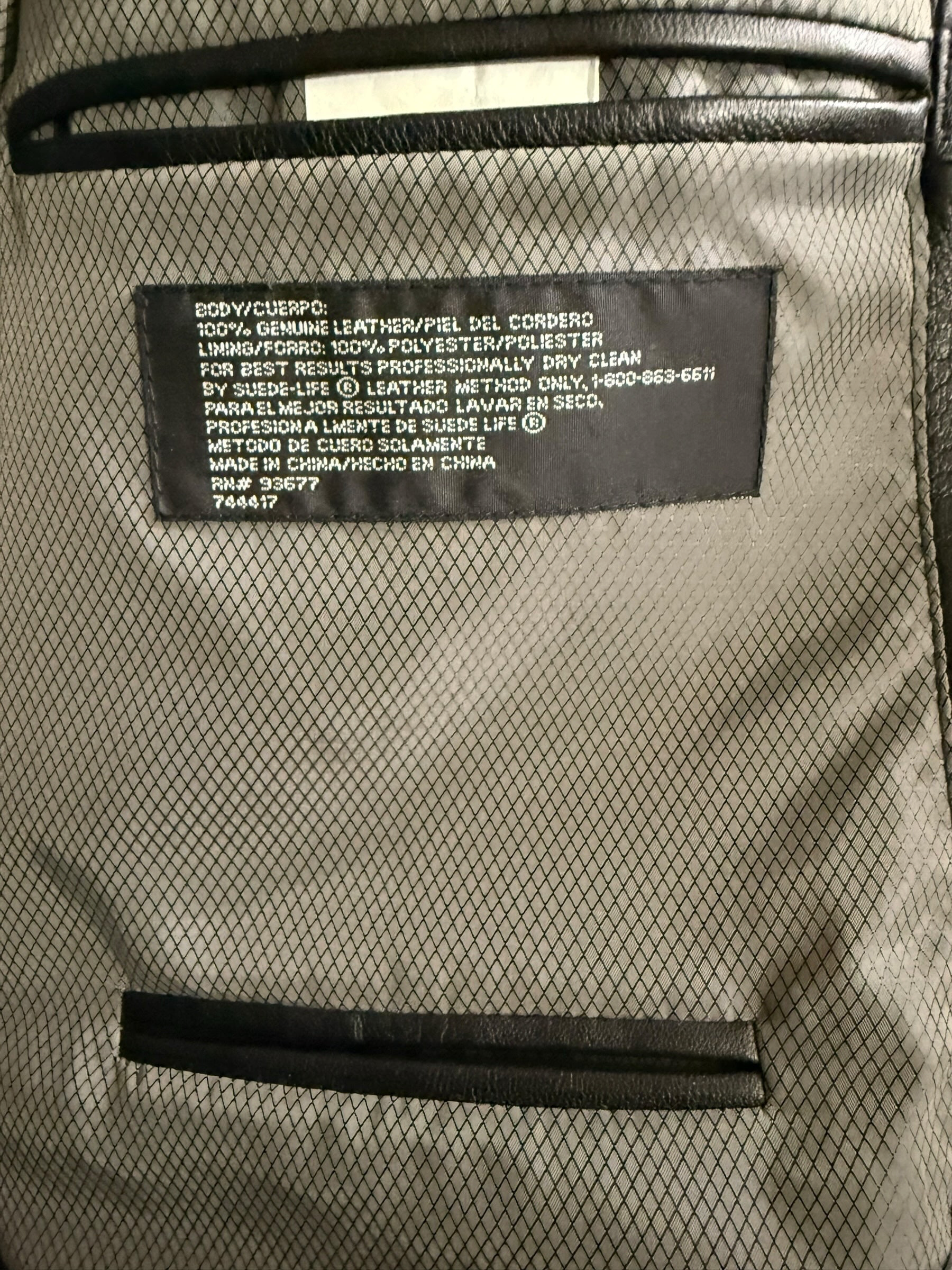 My Store Stafford genuine leather blazer interior label showing material composition and care instructions.