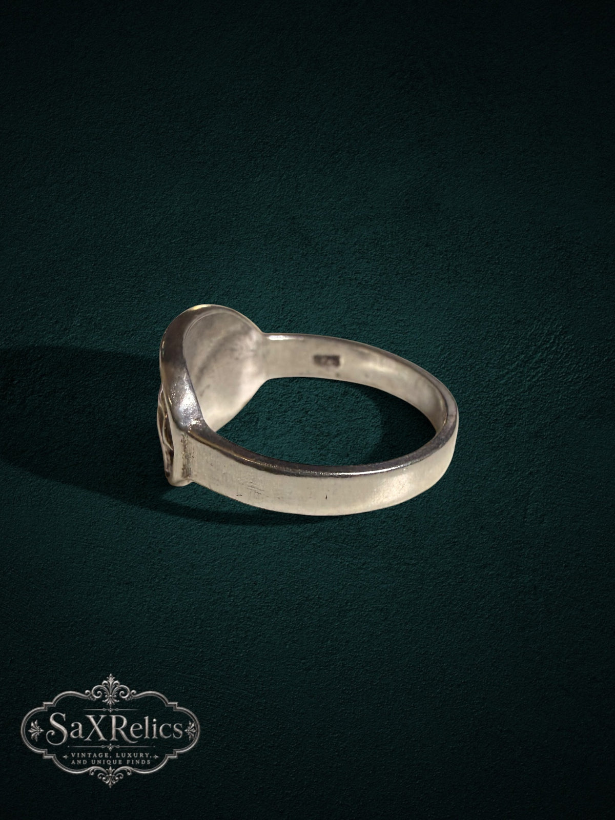 SaX Relics sterling silver signet ring with a detailed big cat relief in a rustic artisanal finish.