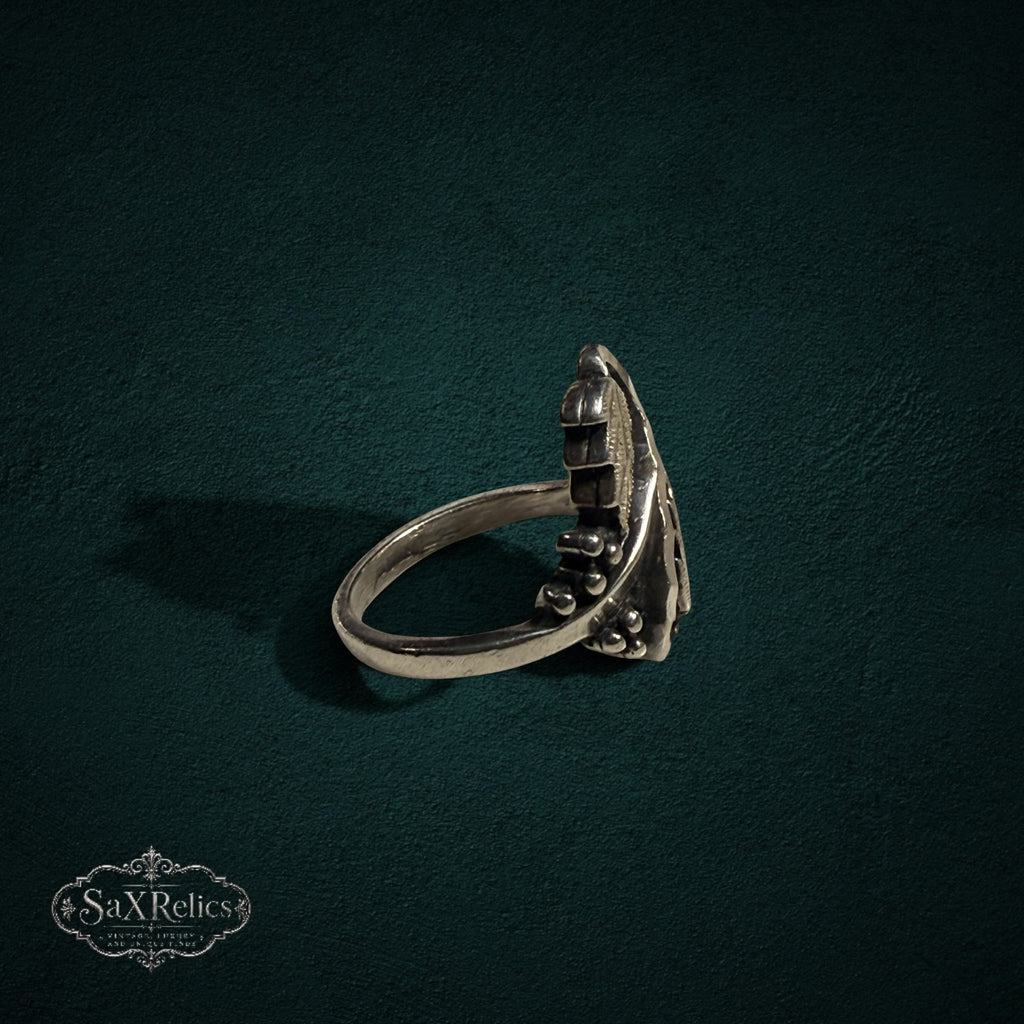 My Store SAXRelics sterling silver ring featuring an intricate botanical leaf and berry design with an oxidized finish.