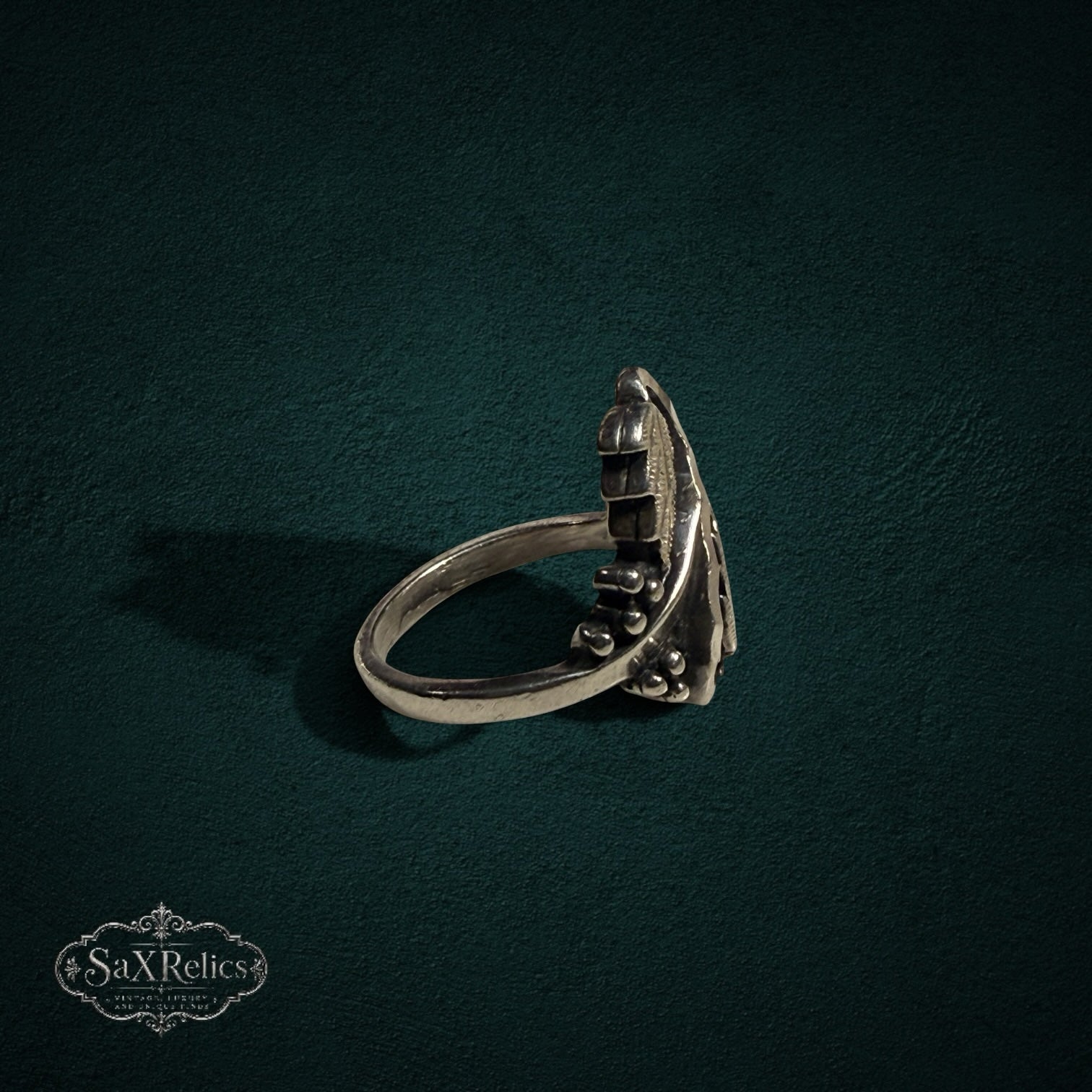 My Store SAXRelics sterling silver ring featuring an intricate botanical leaf and berry design with an oxidized finish.
