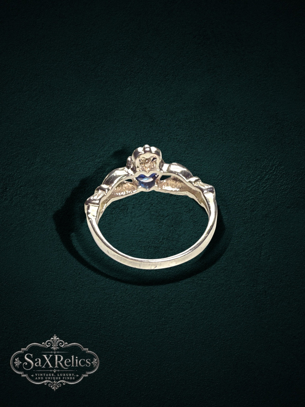 My Store SAXRelics sterling silver Claddagh ring featuring a heart, hands, and crown motif with a blue center stone.