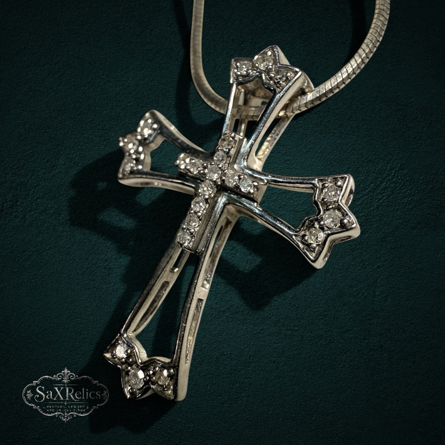 My Store sterling silver cross pendant necklace with clear stones and intricate openwork on a sleek snake chain.