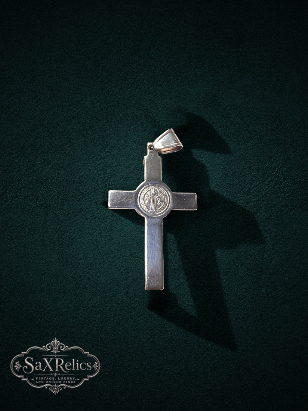 My Store 925 sterling silver crucifix pendant featuring a central Saint Benedict medal on a dark green background