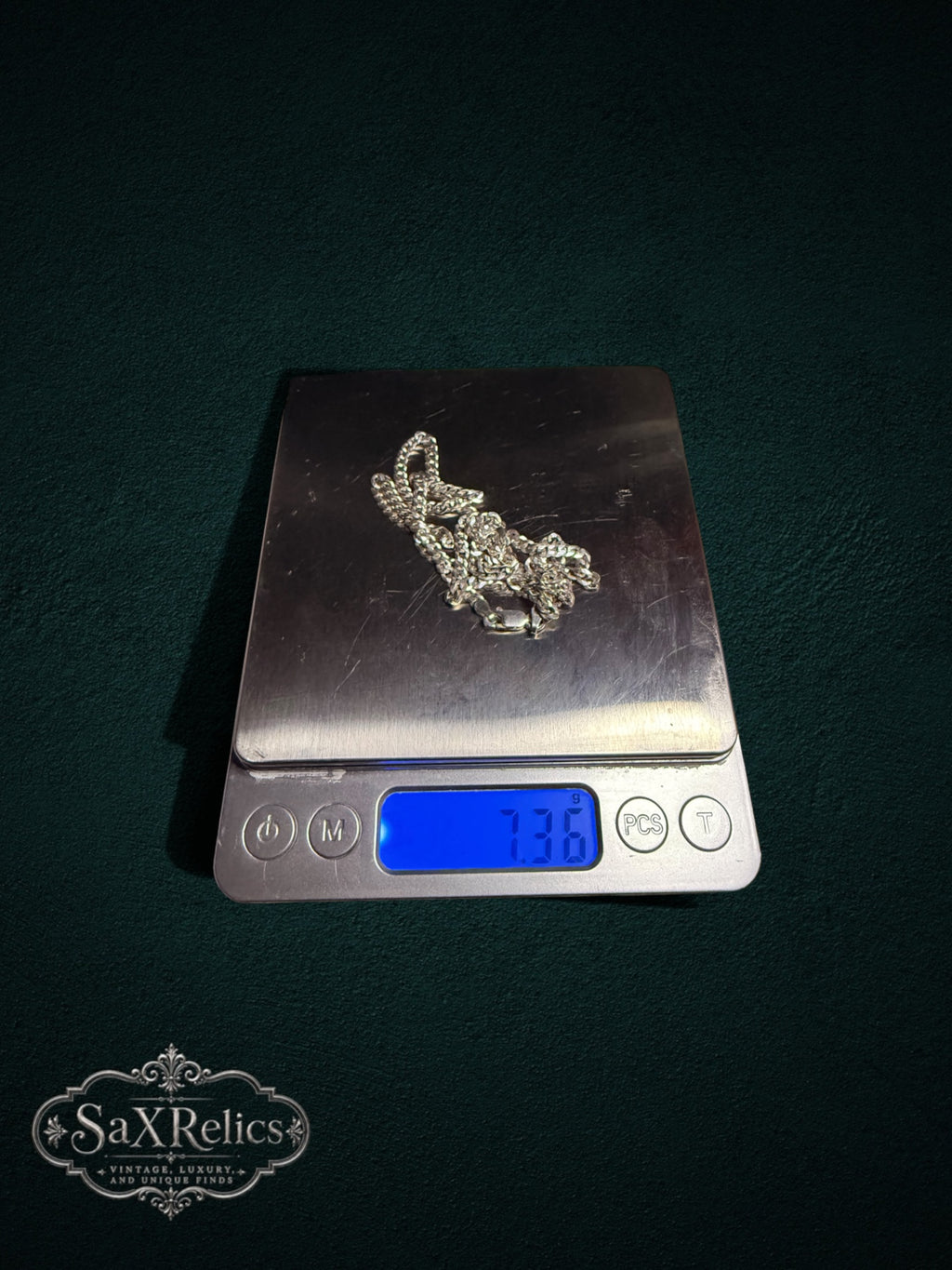 Barbada sterling silver curb chain weighing 7.36 grams on a scale