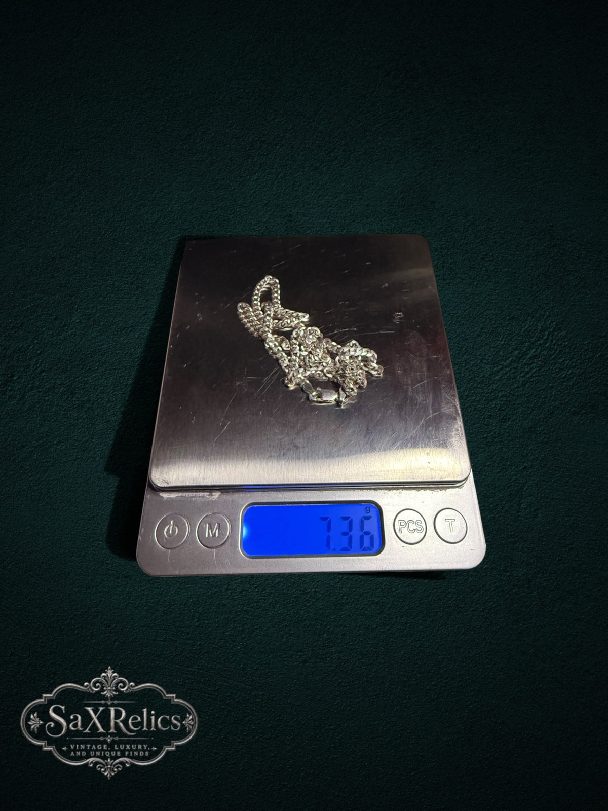 Barbada sterling silver curb chain weighing 7.36 grams on a scale