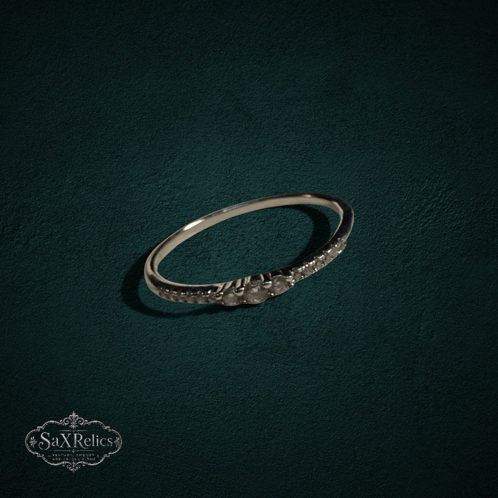 My Store delicate 925 sterling silver band ring with shimmering clear stones on a dark textured background