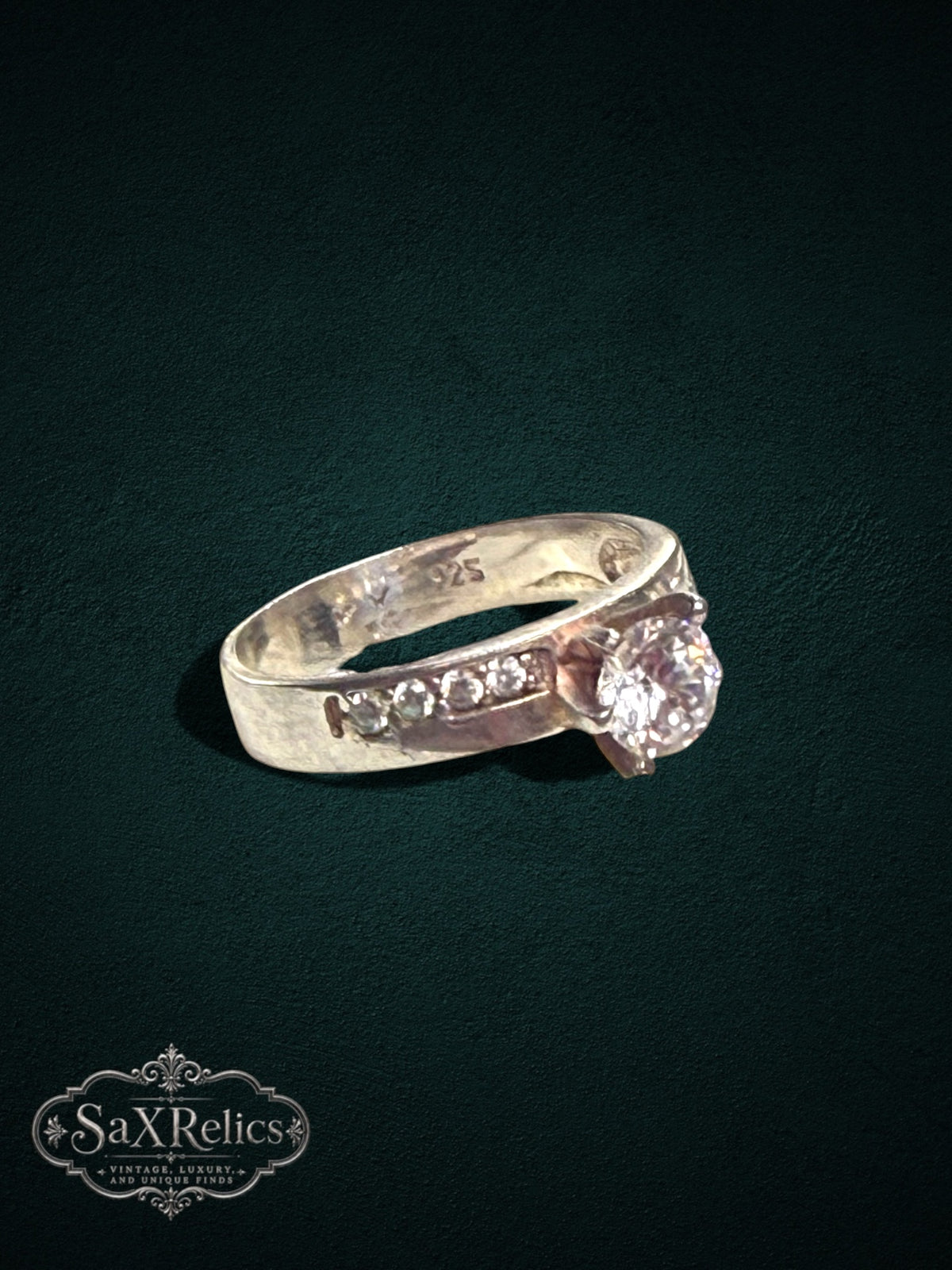 My Store 925 sterling silver engagement ring with a brilliant center stone and channel-set accent diamonds