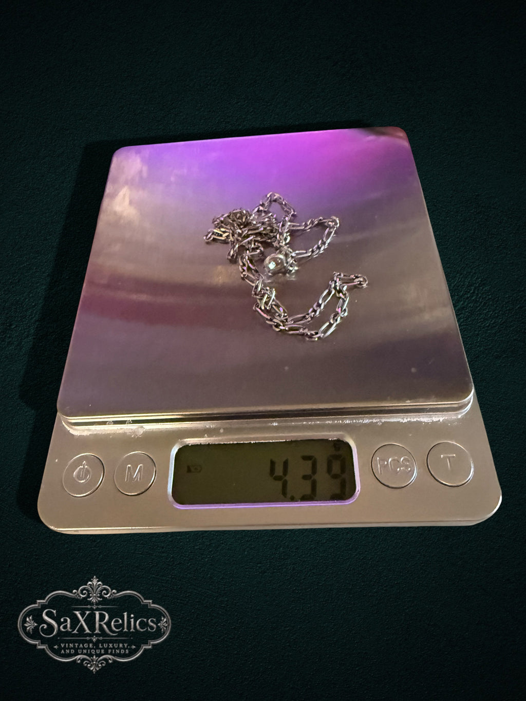 Rosina sterling silver Figaro chain weighing 4.39 grams on a scale