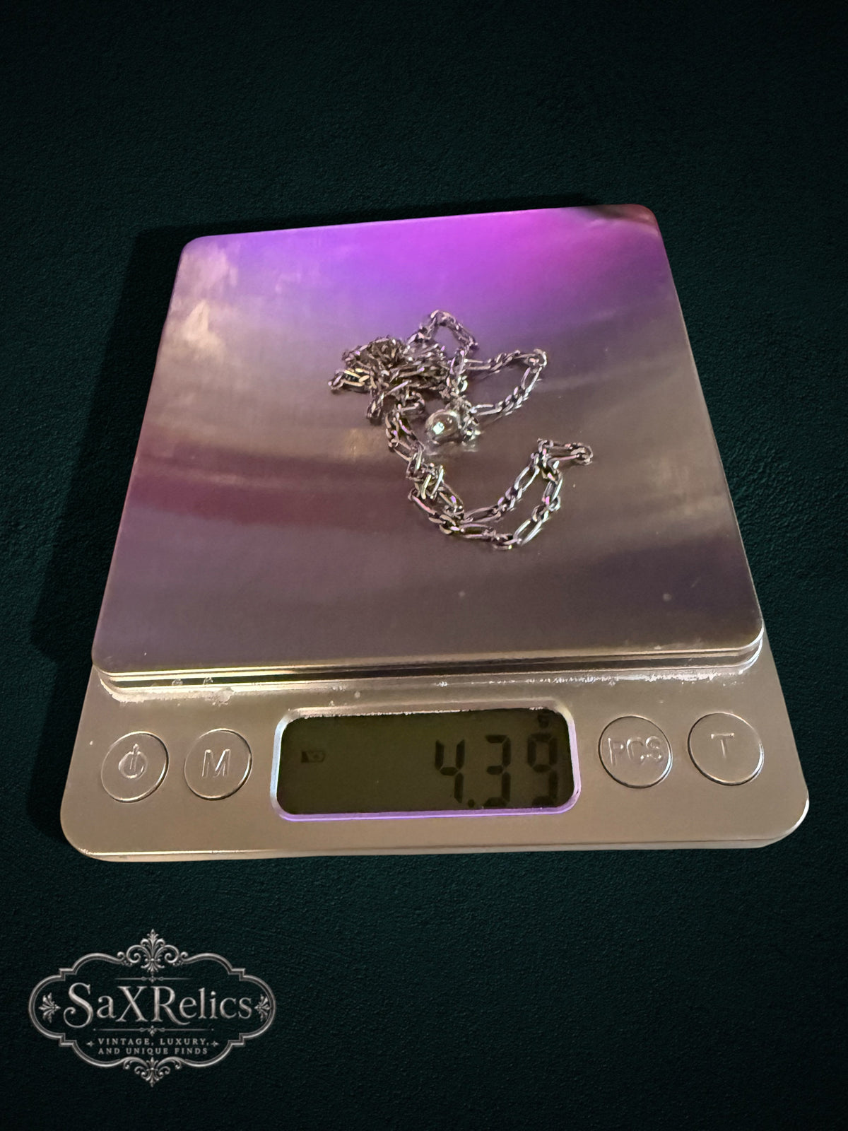 Rosina sterling silver Figaro chain weighing 4.39 grams on a scale