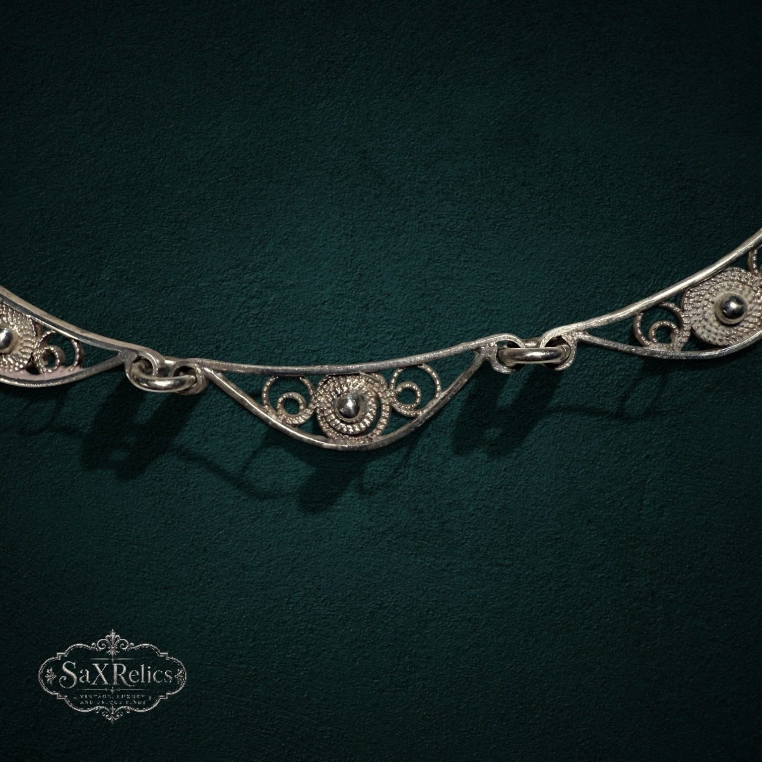 My Store SAXRelics sterling silver filigree statement necklace with intricate wirework and polished silver spheres.