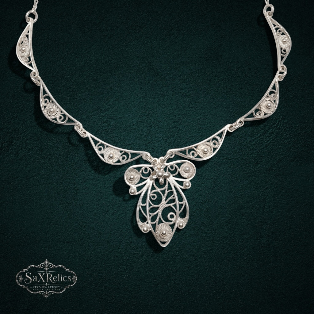 My Store SAXRelics sterling silver filigree statement necklace with intricate wirework and polished silver spheres.