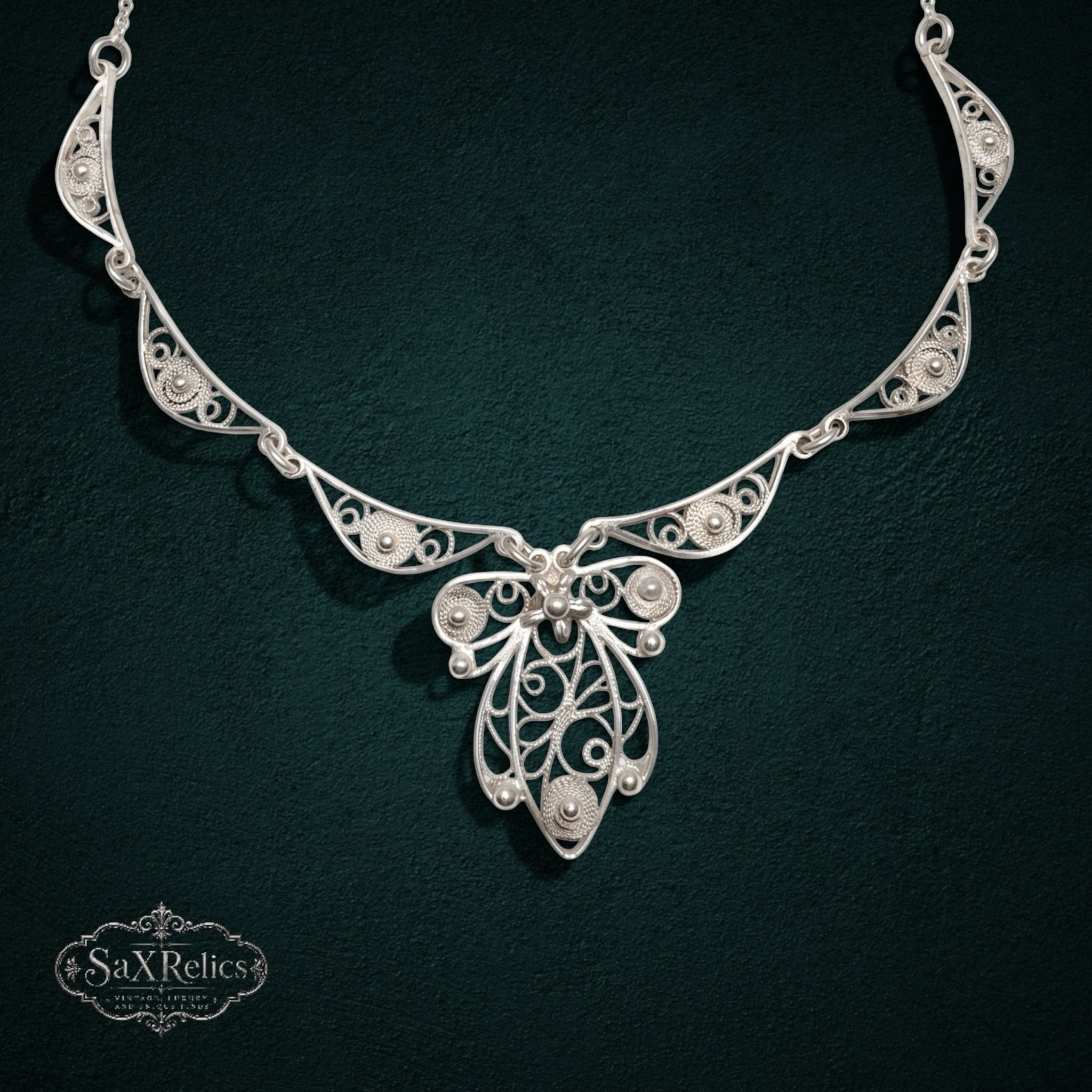 My Store SAXRelics sterling silver filigree statement necklace with intricate wirework and polished silver spheres.