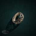 My Store sterling silver band ring featuring an intricate vintage-inspired filigree scrollwork design on a dark background