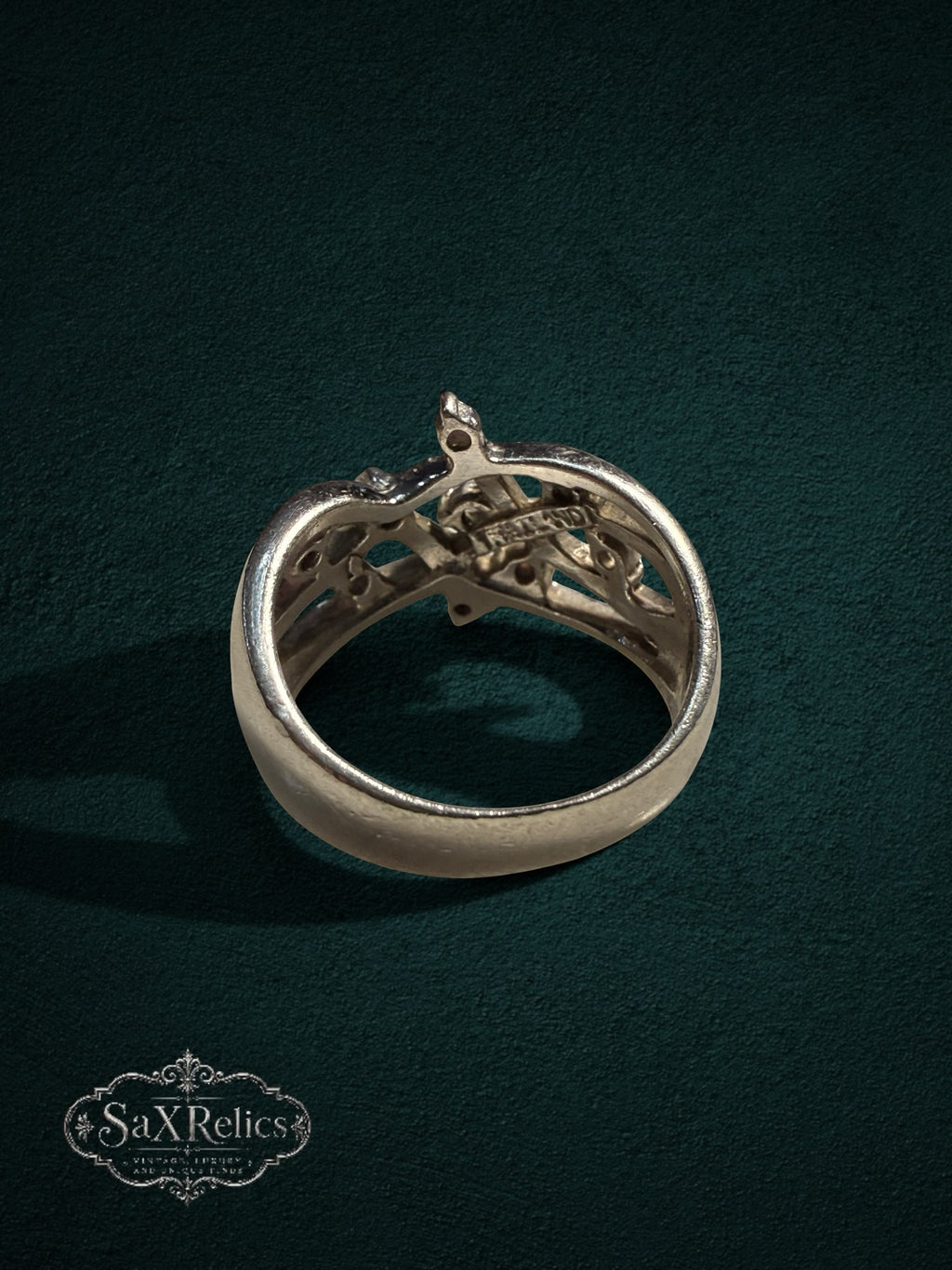 My Store SAXRelics sterling silver statement ring featuring an intricate filigree openwork design on a green background