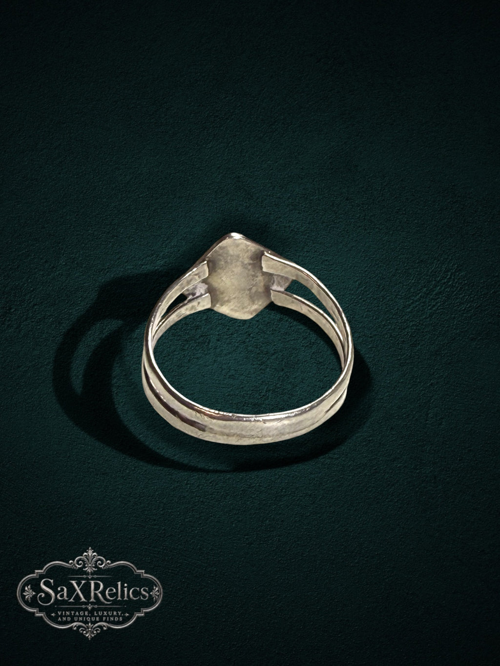 My Store SAXRelics sterling silver geometric statement ring with a split-shank band on a dark textured background